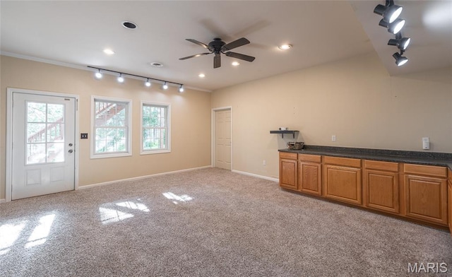 10625 Pine Needle Cir, Rolla, MO 65401 - unfurnished living room with a ceiling fan, light carpet, baseboards, recessed lighting, and crown molding