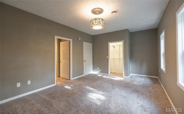 10625 Pine Needle Cir, Rolla, MO 65401 - unfurnished bedroom with carpet flooring, baseboards, and a closet