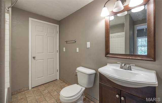 10625 Pine Needle Cir, Rolla, MO 65401 - full bath with toilet, vanity, stone finish flooring, baseboards, and a shower