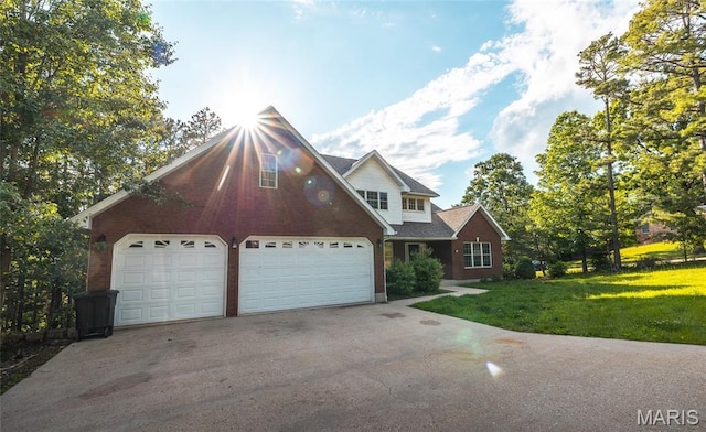 10625 Pine Needle Cir, Rolla, MO 65401 - traditional-style house with asphalt driveway, a front yard, an attached garage, and brick siding