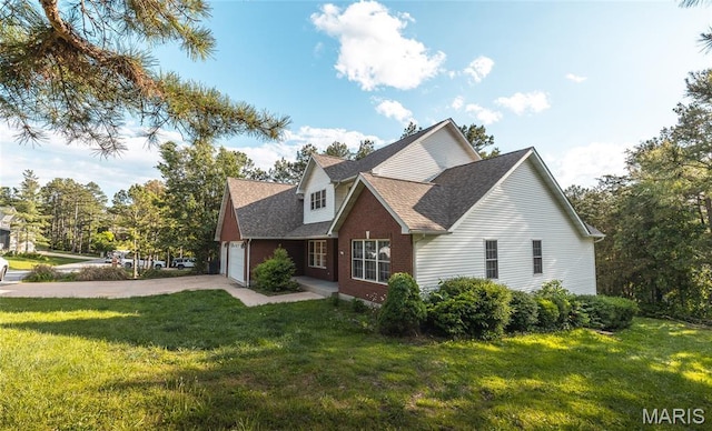 10625 Pine Needle Cir, Rolla, MO 65401 - view of home's exterior with a yard, an attached garage, concrete driveway, a shingled roof, and brick siding