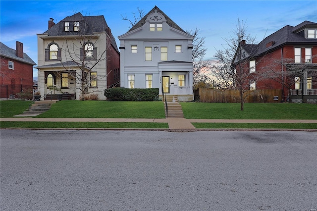 3944 Russell Blvd, Saint Louis, MO 63110 - victorian-style house featuring a porch and a chimney