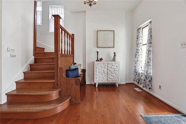 3944 Russell Blvd, Saint Louis, MO 63110 - staircase featuring wood finished floors and baseboards