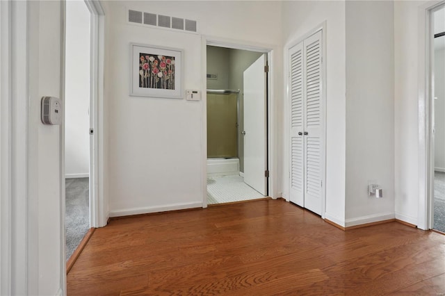 3944 Russell Blvd, Saint Louis, MO 63110 - hallway featuring baseboards and wood finished floors