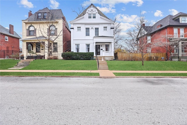 3944 Russell Blvd, Saint Louis, MO 63110 - victorian-style house with covered porch and a chimney