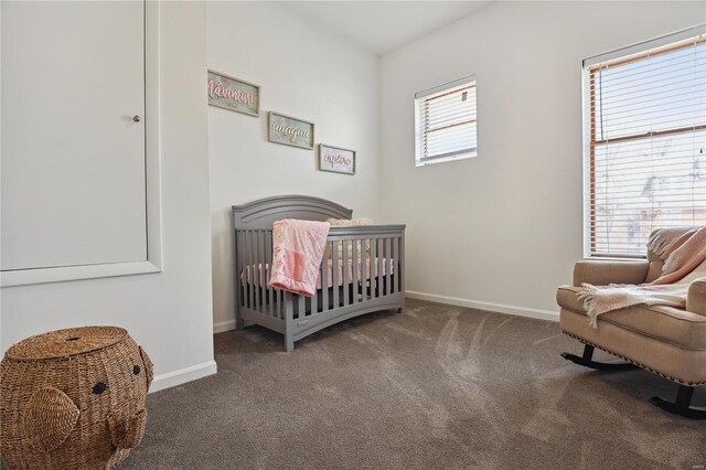 3944 Russell Blvd, Saint Louis, MO 63110 - carpeted bedroom featuring a crib and baseboards