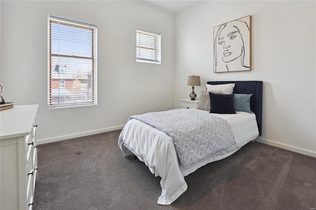 3944 Russell Blvd, Saint Louis, MO 63110 - bedroom featuring dark carpet and baseboards