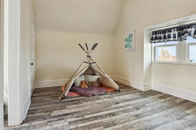 3944 Russell Blvd, Saint Louis, MO 63110 - rec room with wood finished floors, vaulted ceiling, and baseboards