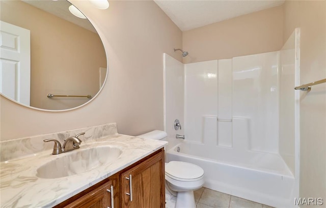 bathroom featuring toilet, tile patterned floors, vanity, and bathtub / shower combination