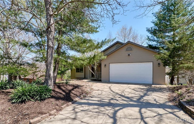view of front of home featuring driveway and an attached garage