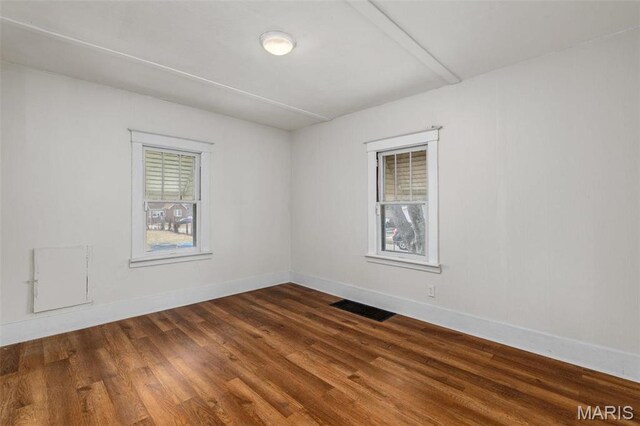 6546 Joseph Ave, Saint Louis, MO 63133 - spare room with dark wood finished floors and baseboards
