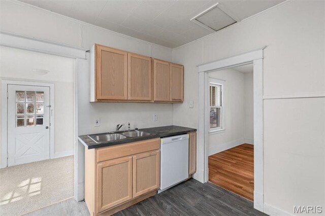 6546 Joseph Ave, Saint Louis, MO 63133 - kitchen with white dishwasher, a sink, dark wood-style flooring, dark countertops, and baseboards
