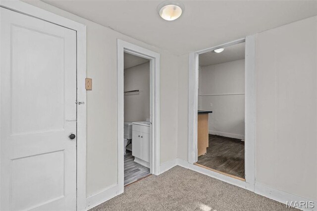 6546 Joseph Ave, Saint Louis, MO 63133 - unfurnished bedroom with baseboards, carpet flooring, and connected bathroom