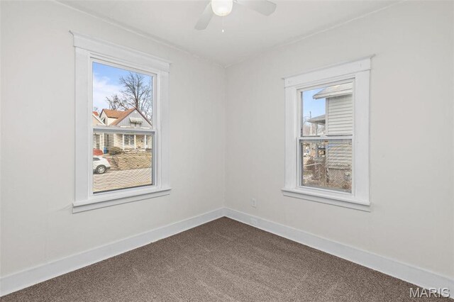 6546 Joseph Ave, Saint Louis, MO 63133 - unfurnished room featuring dark colored carpet, ceiling fan, and baseboards
