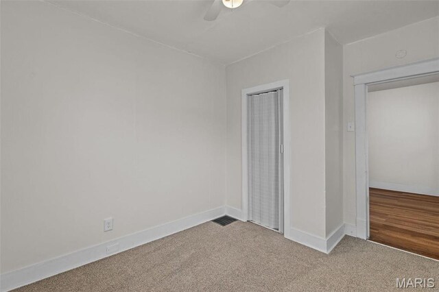 6546 Joseph Ave, Saint Louis, MO 63133 - unfurnished bedroom featuring carpet, baseboards, a ceiling fan, and a closet