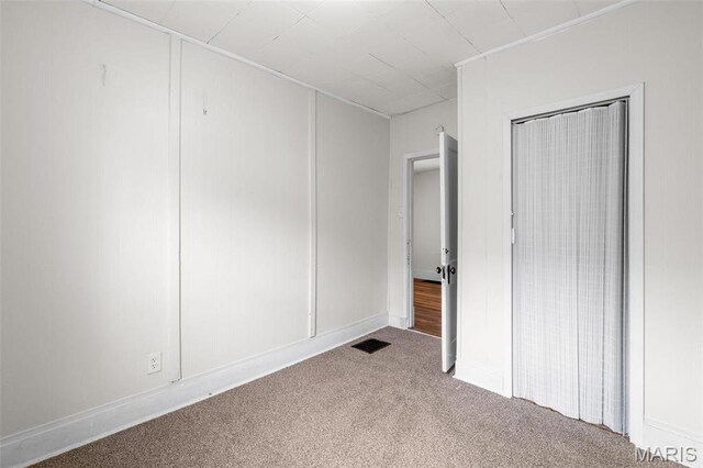 6546 Joseph Ave, Saint Louis, MO 63133 - unfurnished bedroom featuring carpet and a closet