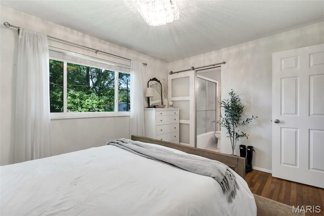 1680 Layven Ave, Florissant, MO 63031 - bedroom with wood finished floors and a textured ceiling