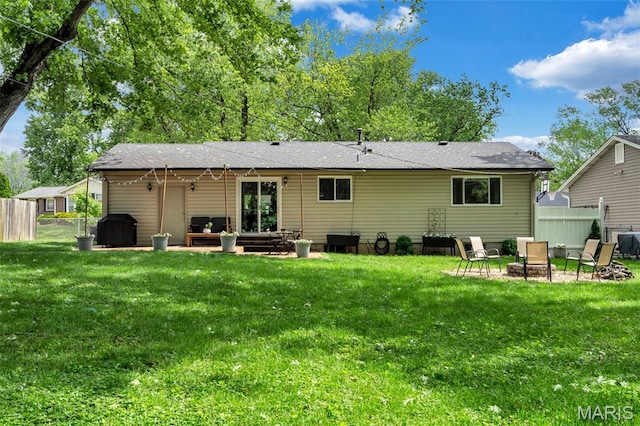 1680 Layven Ave, Florissant, MO 63031 - back of house featuring a patio area and roof with shingles