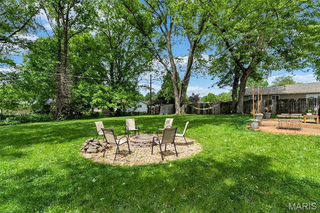 1680 Layven Ave, Florissant, MO 63031 - view of yard with a fire pit and a patio area