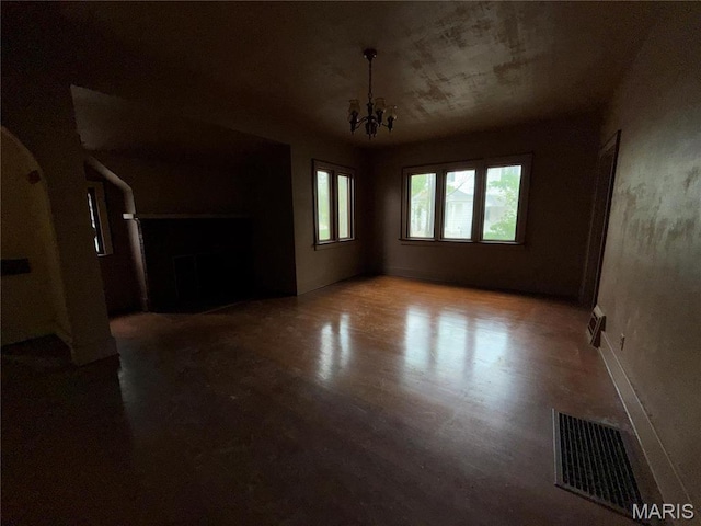 1548 Highland Ave, Alton, IL 62002 - empty room with a chandelier and arched walkways