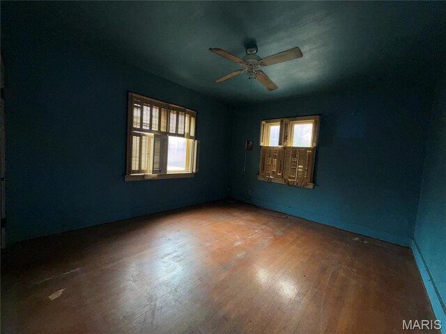 1548 Highland Ave, Alton, IL 62002 - empty room with a ceiling fan, hardwood / wood-style flooring, and baseboards