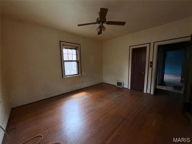 1548 Highland Ave, Alton, IL 62002 - unfurnished room with wood finished floors, ceiling fan, and baseboards