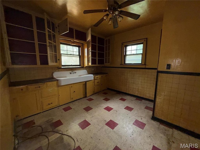 1548 Highland Ave, Alton, IL 62002 - bathroom featuring a sink, tile patterned floors, ceiling fan, and a wainscoted wall