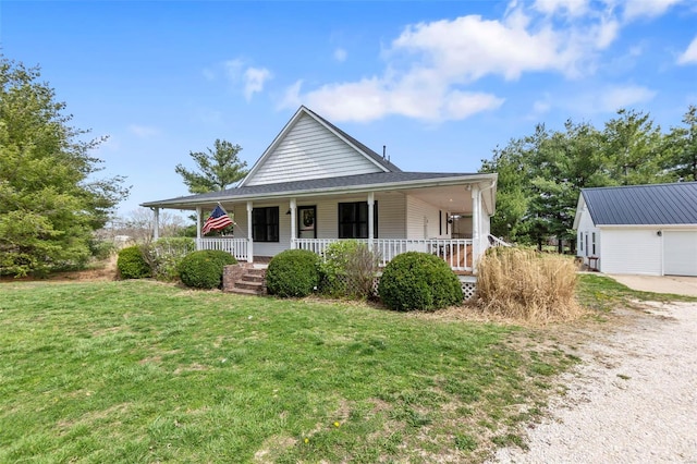 7238 State Highway D, Jackson, MO 63755 - farmhouse inspired home featuring covered porch, a front lawn, dirt driveway, and a garage