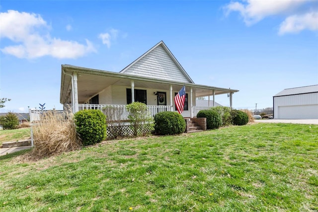 7238 State Highway D, Jackson, MO 63755 - farmhouse inspired home featuring covered porch, a front lawn, and a detached garage