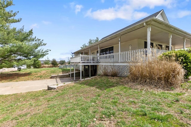 7238 State Highway D, Jackson, MO 63755 - view of home's exterior with driveway, a yard, and a carport