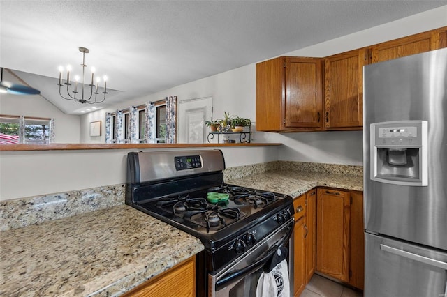 7238 State Highway D, Jackson, MO 63755 - kitchen with stainless steel appliances, a chandelier, brown cabinets, hanging light fixtures, and lofted ceiling