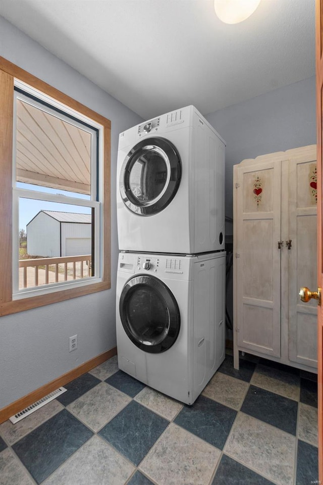 7238 State Highway D, Jackson, MO 63755 - washroom featuring estacked washer and dryer and baseboards