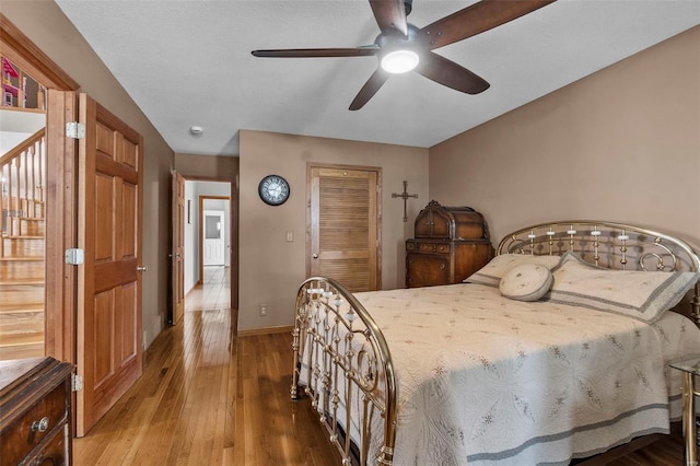 7238 State Highway D, Jackson, MO 63755 - bedroom featuring wood finished floors, a closet, baseboards, and ceiling fan