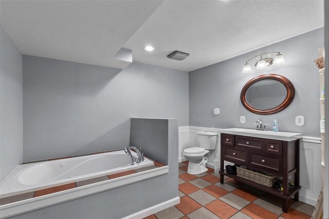 7238 State Highway D, Jackson, MO 63755 - full bathroom featuring toilet, a garden tub, vanity, and a textured ceiling