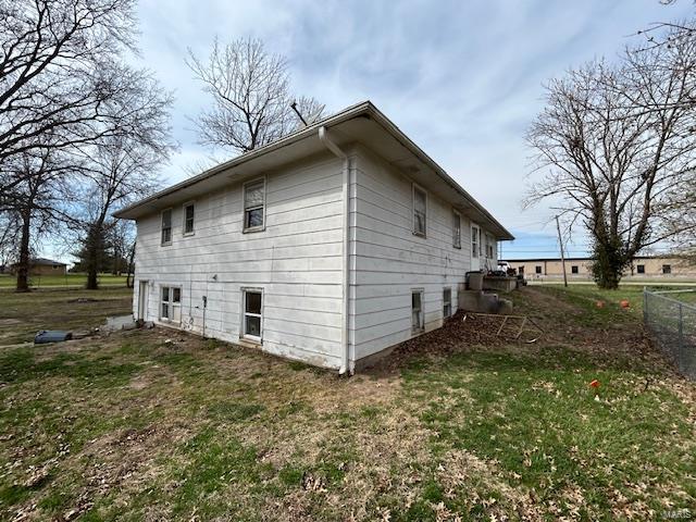 view of property exterior with fence