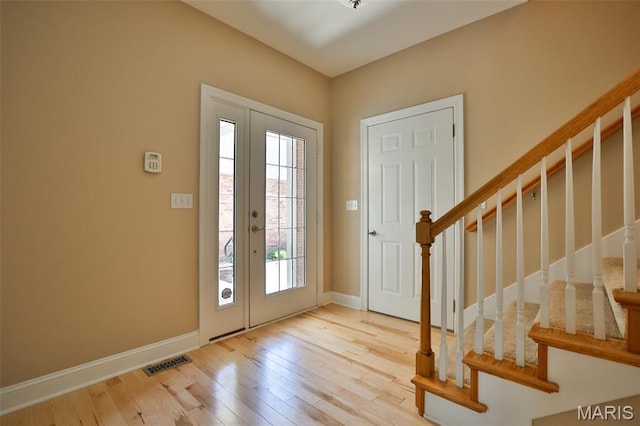 409 Country Club Vw, Edwardsville, IL 62025 - foyer entrance featuring hardwood / wood-style flooring, stairs, and baseboards