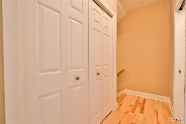 409 Country Club Vw, Edwardsville, IL 62025 - hallway featuring an upstairs landing, light wood-style flooring, and baseboards