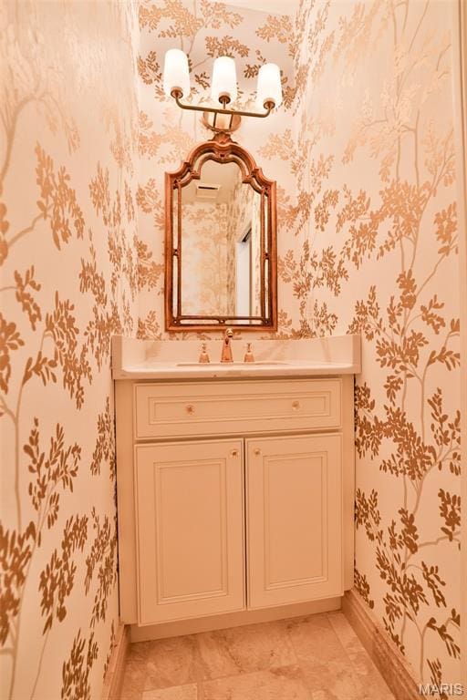 409 Country Club Vw, Edwardsville, IL 62025 - bathroom featuring wallpapered walls, baseboards, and vanity