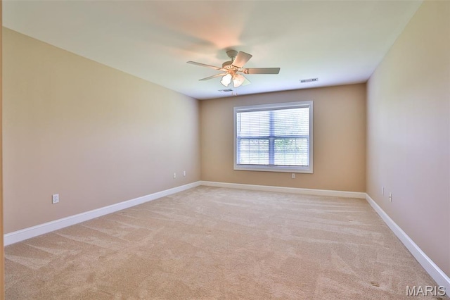 409 Country Club Vw, Edwardsville, IL 62025 - spare room with ceiling fan, light carpet, and baseboards