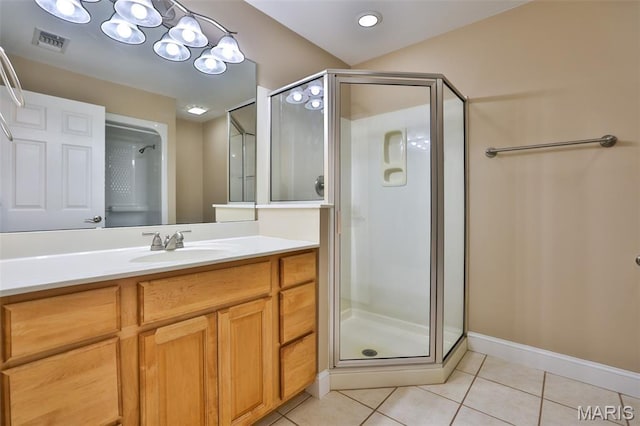 409 Country Club Vw, Edwardsville, IL 62025 - full bath featuring tile patterned floors, a stall shower, vanity, and baseboards