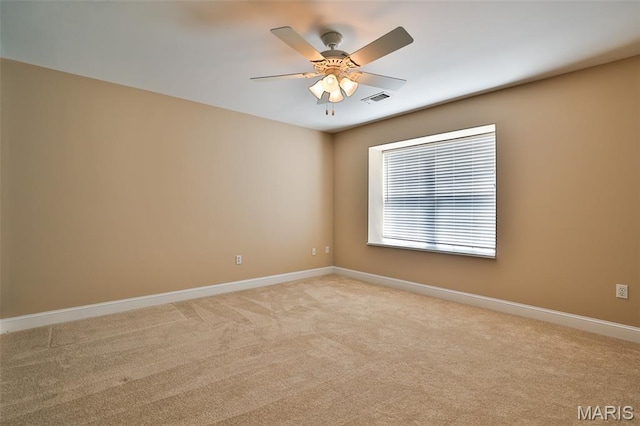 409 Country Club Vw, Edwardsville, IL 62025 - empty room with baseboards, light carpet, and a ceiling fan