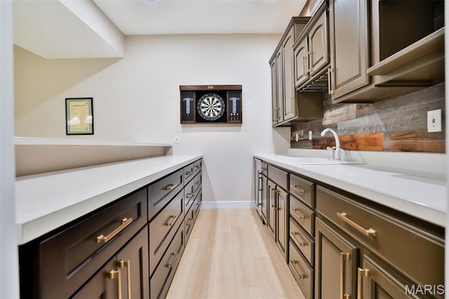 409 Country Club Vw, Edwardsville, IL 62025 - kitchen with a sink, light countertops, baseboards, and backsplash