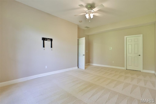 409 Country Club Vw, Edwardsville, IL 62025 - spare room featuring a ceiling fan, light colored carpet, and baseboards