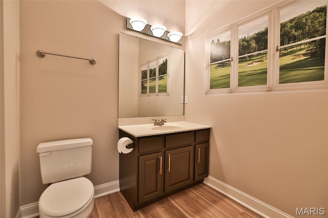 409 Country Club Vw, Edwardsville, IL 62025 - half bath featuring baseboards, wood finished floors, toilet, and vanity
