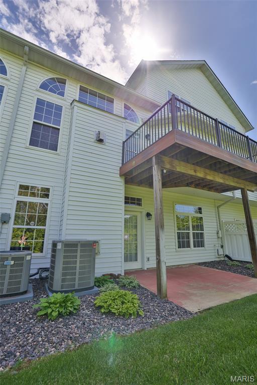409 Country Club Vw, Edwardsville, IL 62025 - back of property with central AC unit, a patio, and a wooden deck