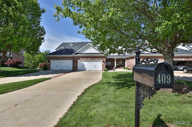 409 Country Club Vw, Edwardsville, IL 62025 - view of front of home with driveway, a front lawn, brick siding, and an attached garage