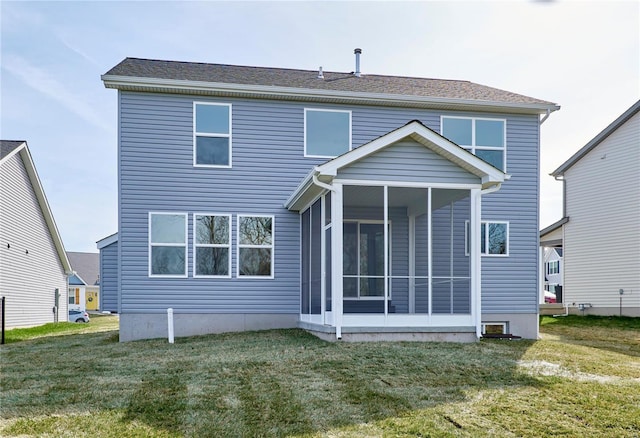 back of property with a sunroom and a lawn