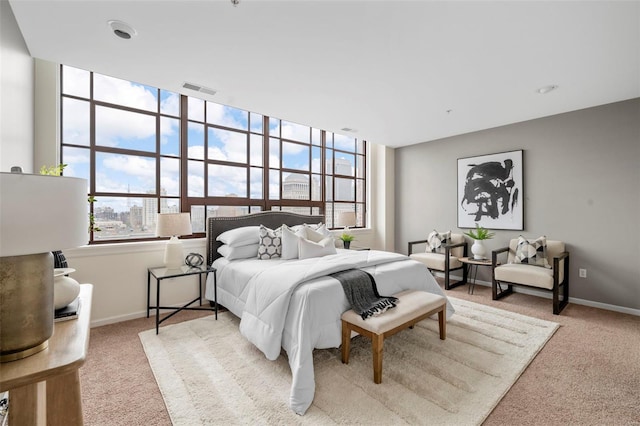 carpeted bedroom with baseboards