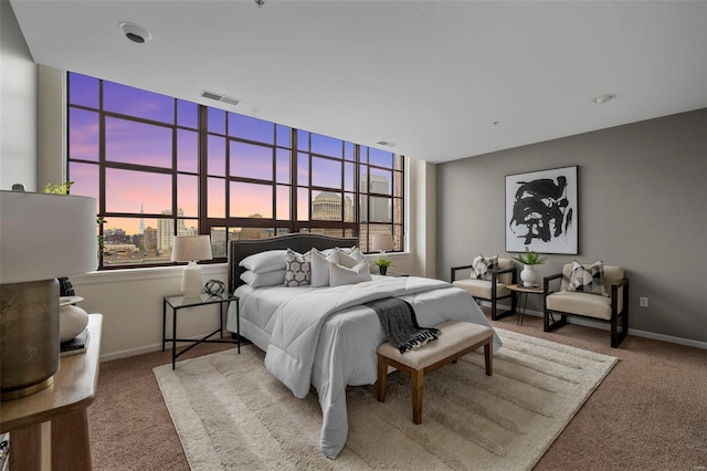 bedroom with carpet floors and baseboards