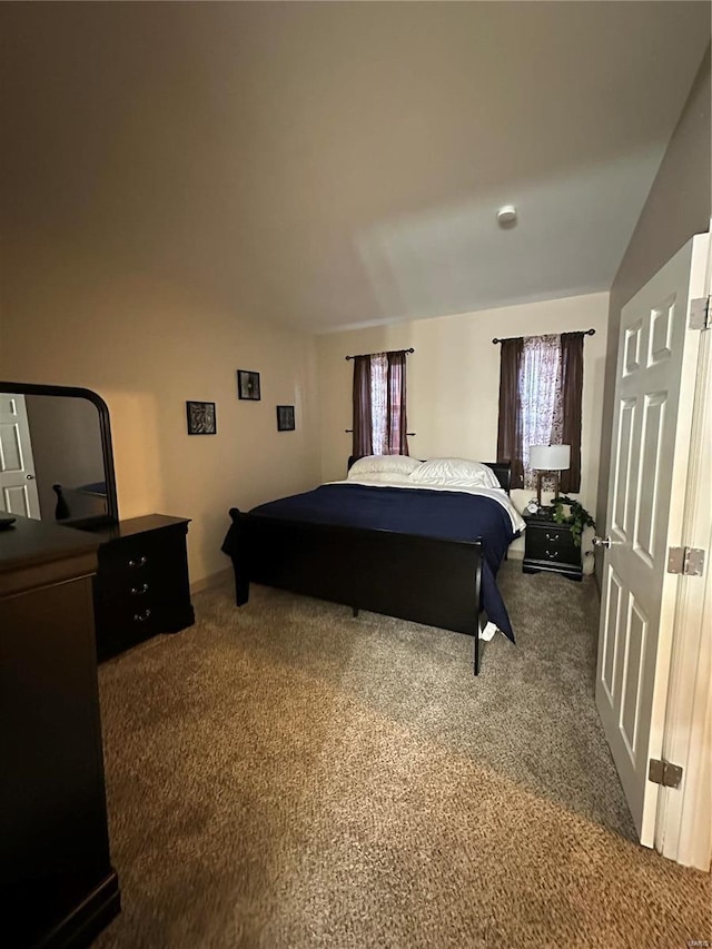 5316 Pershing Ave Unit 507, Saint Louis, MO 63112 - bedroom featuring carpet floors and vaulted ceiling